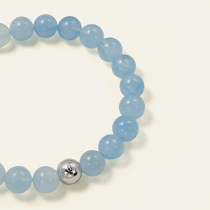 Close-up of AAA Brazilian Aquamarine beads showcasing a refreshing oceanic blue and jelly-like translucency, paired with the Soul Lykke 316L surgical steel bead.