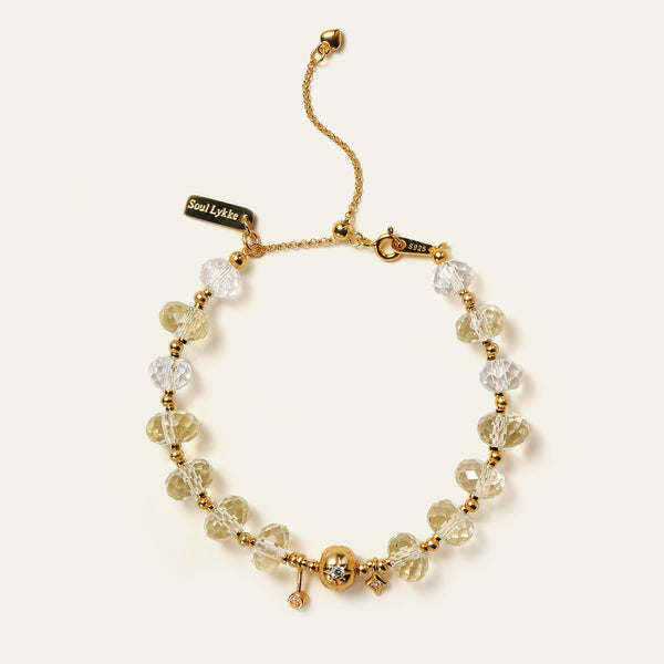 Faceted natural Champagne Citrine and Clear Quartz beaded bracelet featuring 24K gold-plated charms and the engraved Soul Lykke signature tag.