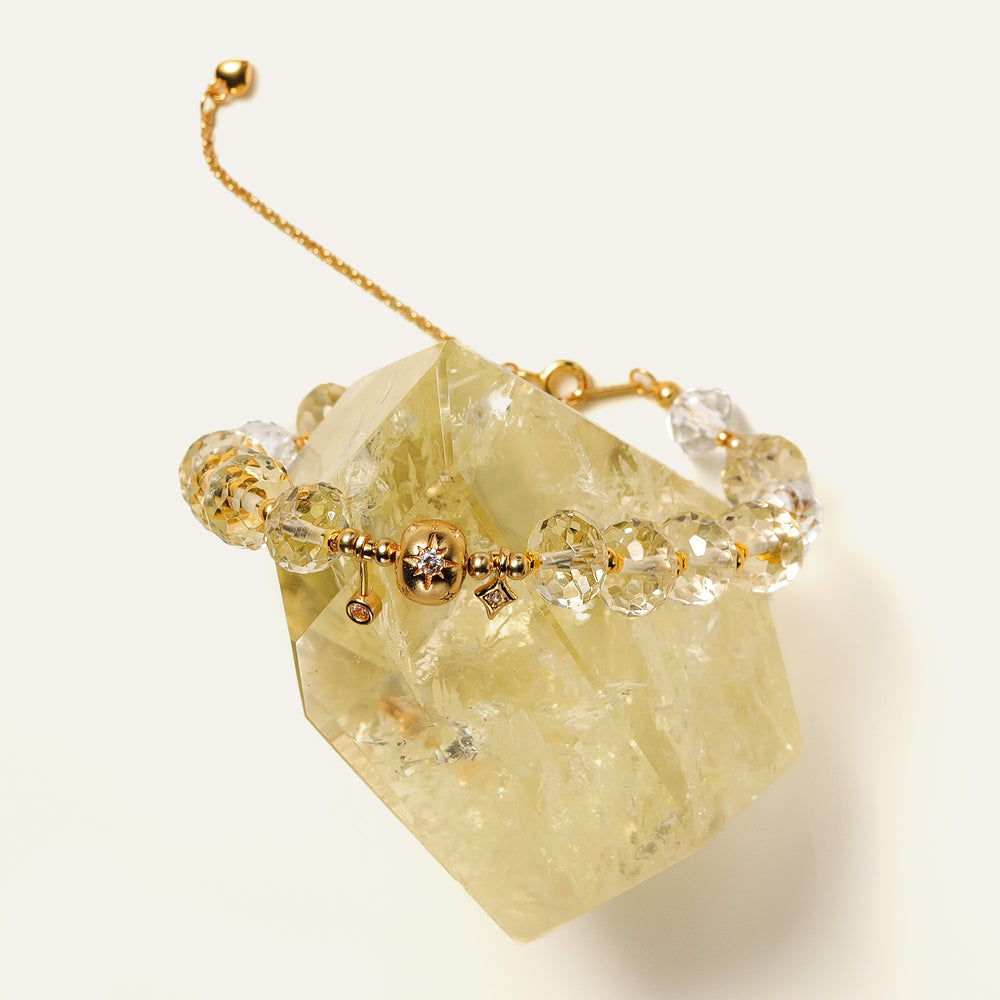 Close-up of the bracelet's adjustable 24K gold-plated sterling silver chain and faceted natural Citrine beads. This is a natural gemstone and healing crystal bracelet by Soul Lykke.