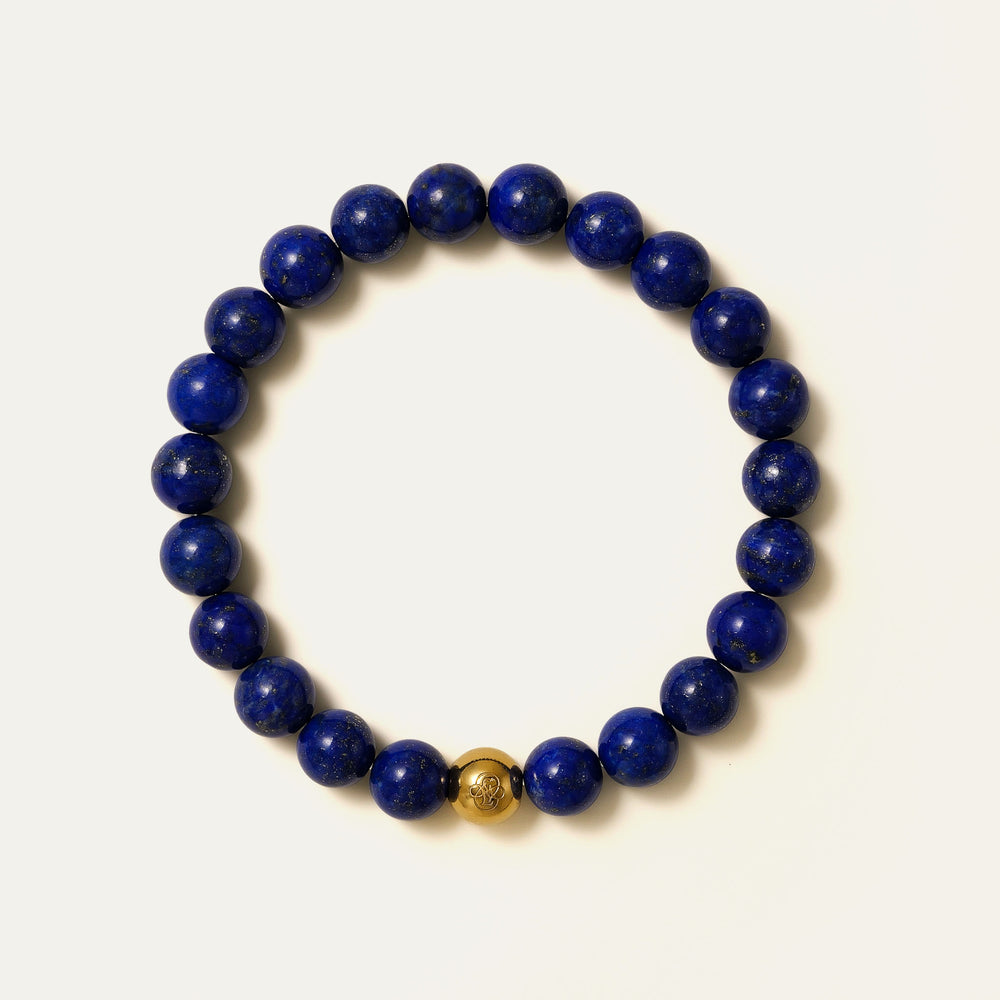 The Core Essential 8mm pure Lapis Lazuli bracelet by Soul Lykke. Crafted from collector-level AAA-grade stones from historic Afghan mines, this luxury crystal jewelry features a deeply saturated royal blue expanse. This is a natural gemstone bracelet by Soul Lykke.