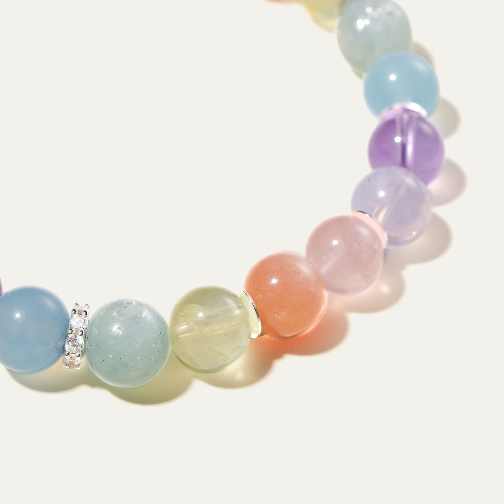 The Monet pastel multi-gemstone bracelet by Soul Lykke. A serene watercolor-inspired gradient featuring 8mm AAA-grade Hibiscus Rose Quartz, Teal Lepidolite, Aquamarine, and Lavender Amethyst on a seamless background. This is a healing crystal bracelet by Soul Lykke.