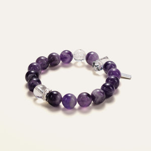 Angled view of the Soul Lykke Lucid Dreamer bracelet, showcasing the striking white banding of natural Dream Chevron Amethyst and icy clear quartz spheres.