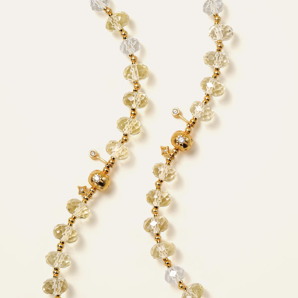 Vertical close-up of faceted natural Champagne Citrine and Clear Quartz beads with 24K gold-plated star charms.
