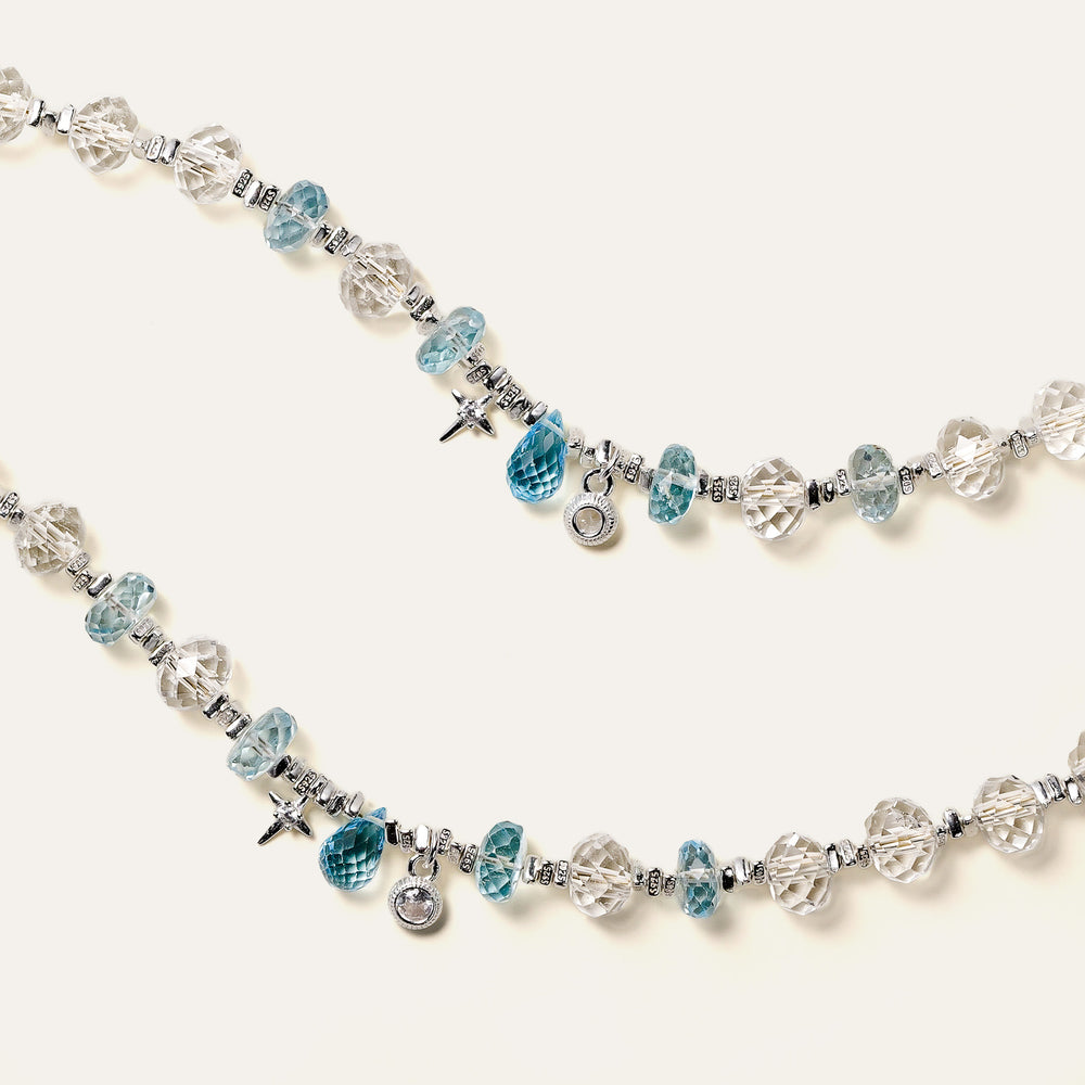 Faceted natural Clear Quartz and Blue Topaz beaded bracelet with an adjustable chain and the engraved Soul Lykke signature tag. This is a natural gemstone and healing crystal bracelet by Soul Lykke.