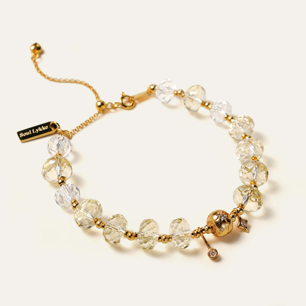 Close-up of the bracelet's adjustable 24K gold-plated sterling silver chain and faceted natural Citrine beads. This is a natural gemstone and healing crystal bracelet by Soul Lykke.