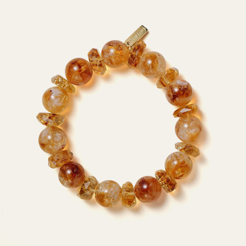 Bold 12mm natural Golden Phantom Citrine beaded bracelet featuring distinct pyramid inclusions and the engraved Soul Lykke signature tag. This is a natural gemstone and healing crystal bracelet by Soul Lykke.
