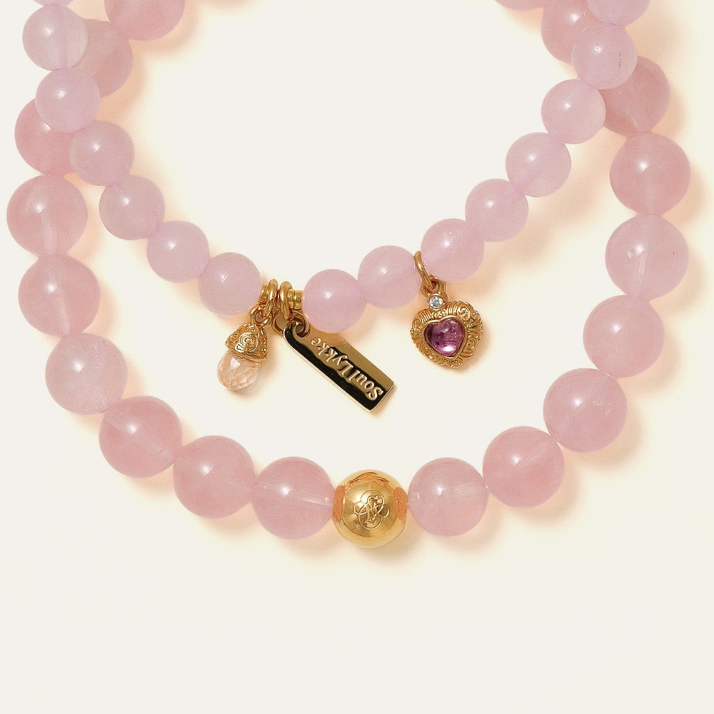 Core Essential bracelet featuring 8mm AAA natural Madagascar Hibiscus Rose Quartz and the Soul Lykke 14K gold PVD signature bead. This is a natural gemstone and healing crystal bracelet by Soul Lykke.