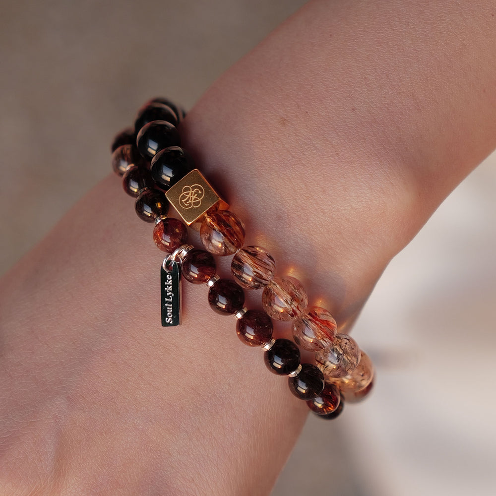 8mm natural Black Gold Super Seven and Obsidian beaded split bracelet with a 14K gold PVD square signature bead. This is a natural gemstone and healing crystal bracelet by Soul Lykke.