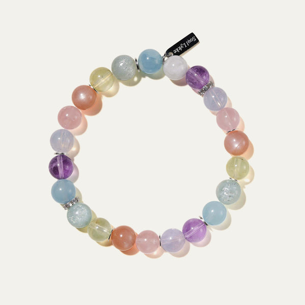 The Monet pastel multi-gemstone bracelet by Soul Lykke. A serene watercolor-inspired gradient featuring 8mm AAA-grade Hibiscus Rose Quartz, Teal Lepidolite, Aquamarine, and Lavender Amethyst on a seamless background. This is a healing crystal bracelet by Soul Lykke.