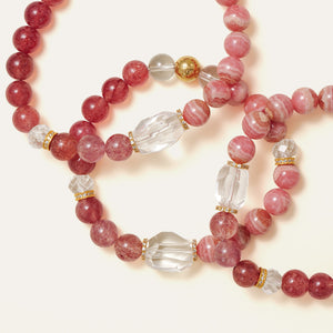 Beautifully layered natural Lace Rhodochrosite and Star Strawberry Quartz bracelets, highlighting the delicate gold accents and the Soul Lykke signature bead.
