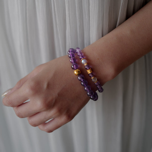 Elegant styling of premium Amethyst and Labradorite crystal jewelry worn by a model, capturing the tranquil energy and inner focus of the Soul Lykke brand.
