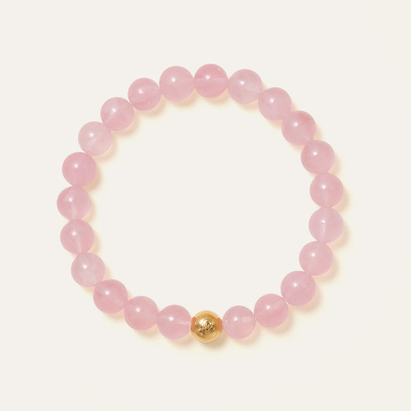 Core Essential bracelet featuring 8mm AAA natural Madagascar Hibiscus Rose Quartz and the Soul Lykke 14K gold PVD signature bead. This is a natural gemstone and healing crystal bracelet by Soul Lykke.