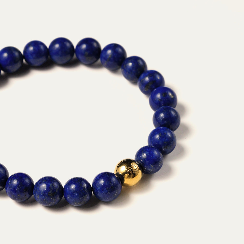 The Core Essential 8mm pure Lapis Lazuli bracelet by Soul Lykke. Crafted from collector-level AAA-grade stones from historic Afghan mines, this luxury crystal jewelry features a deeply saturated royal blue expanse. This is a natural gemstone bracelet by Soul Lykke.