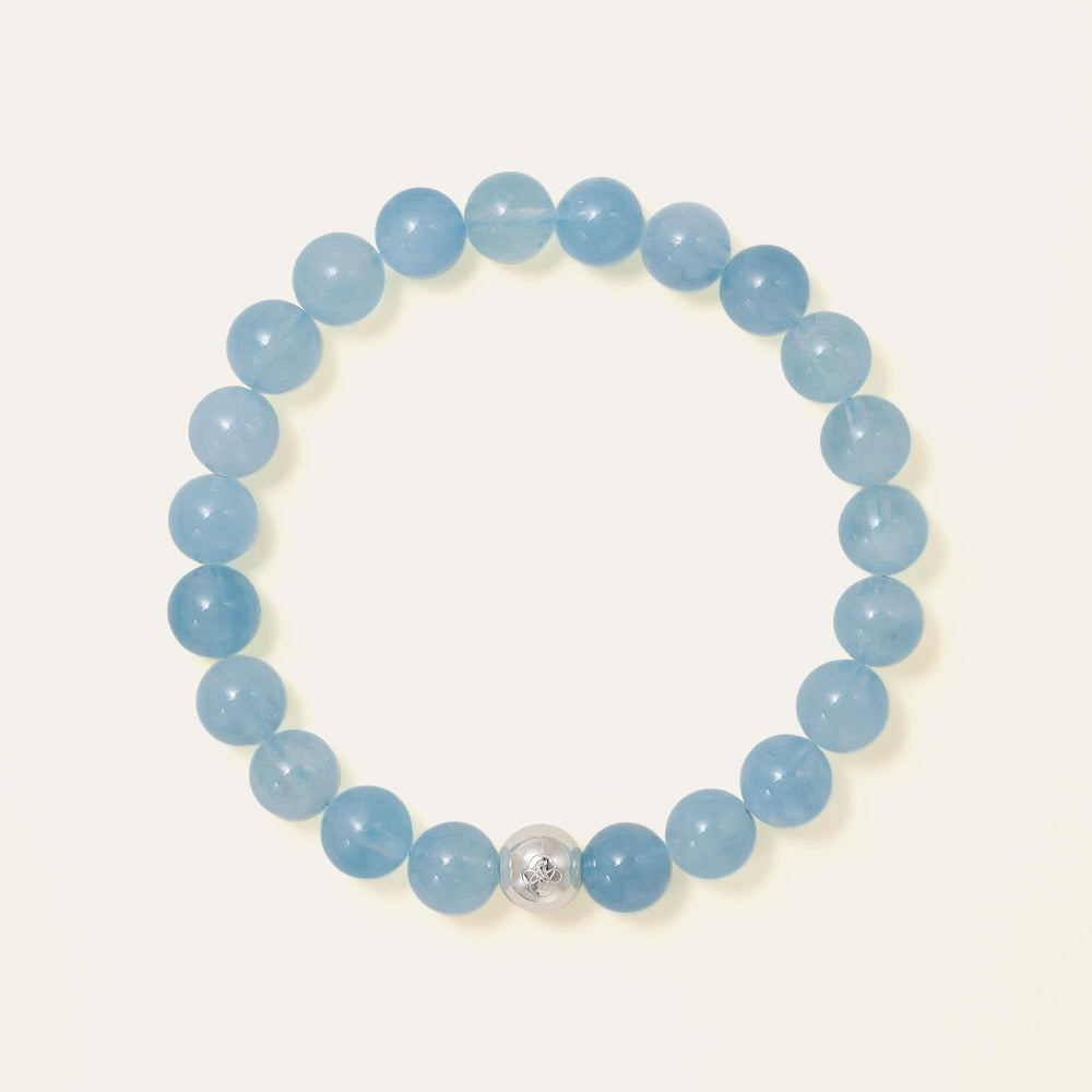 Core Essential bracelet featuring 8mm AAA natural Brazilian Aquamarine with oceanic blue translucency and the Soul Lykke white gold PVD signature bead. This is a natural gemstone and healing crystal bracelet by Soul Lykke.