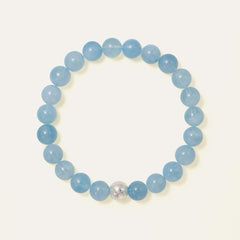 Core Essential bracelet featuring 8mm AAA natural Brazilian Aquamarine with oceanic blue translucency and the Soul Lykke white gold PVD signature bead. This is a natural gemstone and healing crystal bracelet by Soul Lykke.