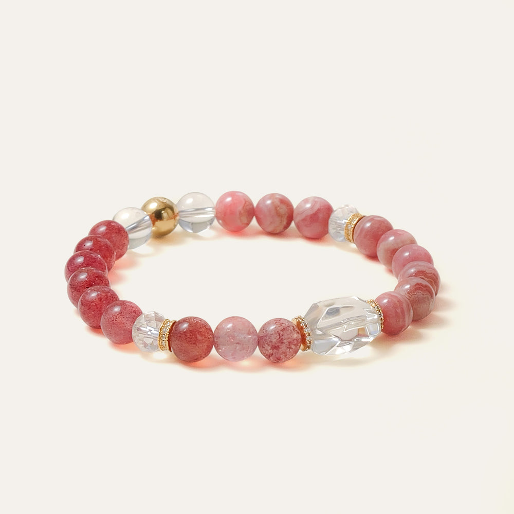 Elegant beaded bracelet combining 8mm natural Lace Rhodochrosite, Star Strawberry Quartz, and a faceted Clear Quartz centerpiece, featuring the Soul Lykke signature gold bead. This is a natural gemstone and healing crystal bracelet by Soul Lykke.