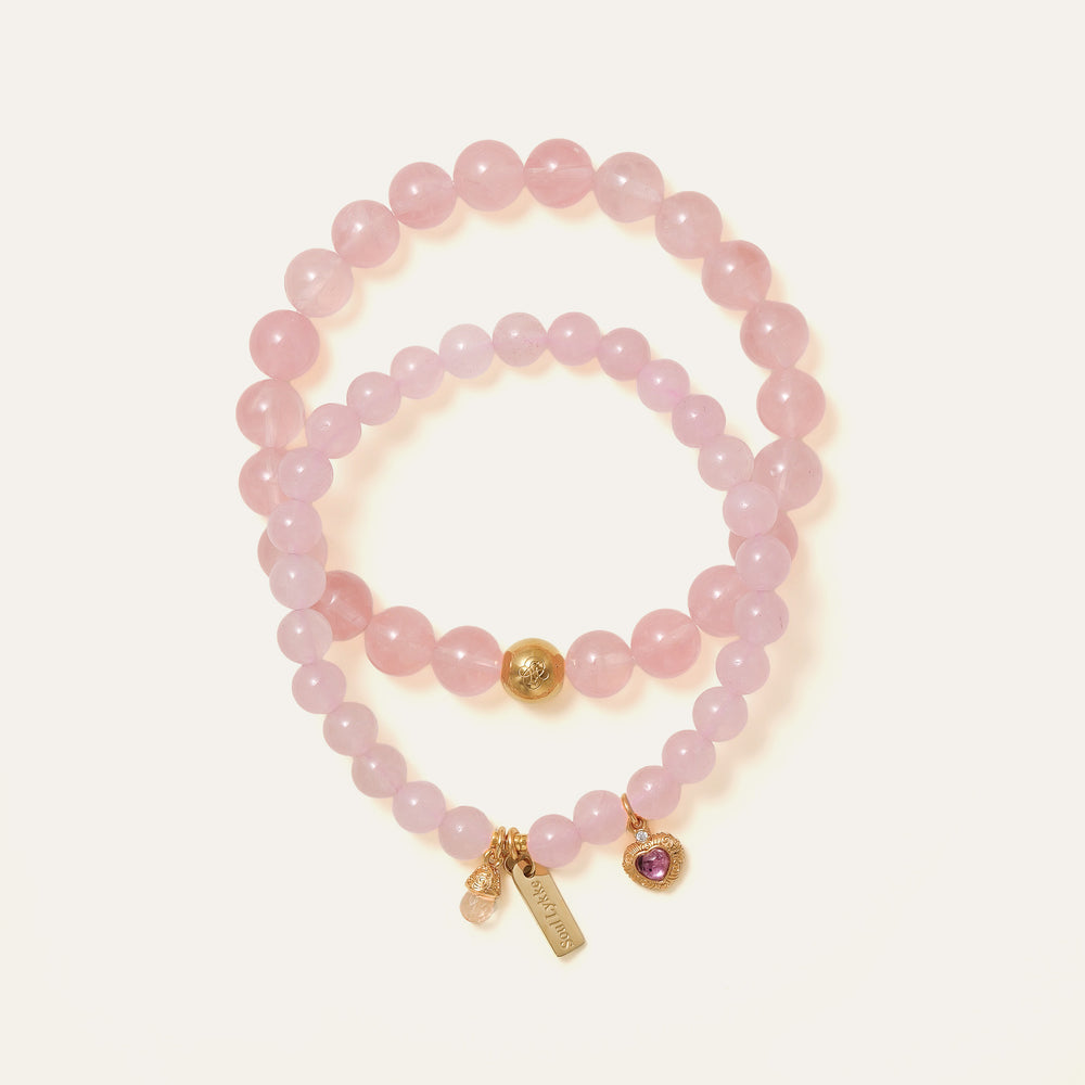 Core Essential bracelet featuring 8mm AAA natural Madagascar Hibiscus Rose Quartz and the Soul Lykke 14K gold PVD signature bead. This is a natural gemstone and healing crystal bracelet by Soul Lykke.