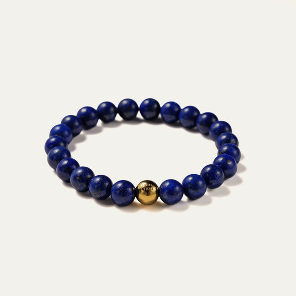 Angled view of the Core Essential pure Lapis Lazuli bracelet. Aligned with the Throat and Third Eye Chakras, this midnight-blue healing crystal clears mental noise and empowers the wearer with intellectual sovereignty.