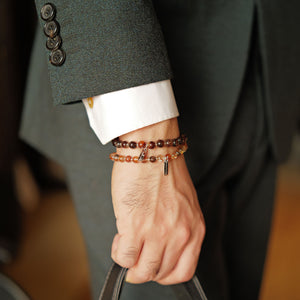 Executive styling featuring the Soul Lykke Eclipse Gold dense-inclusion Black Gold Super Seven layered with The Shadow Gold bracelet.