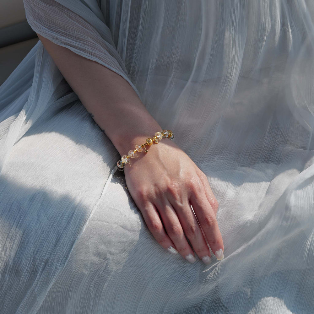 Close-up of the bracelet's adjustable 24K gold-plated sterling silver chain and faceted natural Citrine beads. This is a natural gemstone and healing crystal bracelet by Soul Lykke.