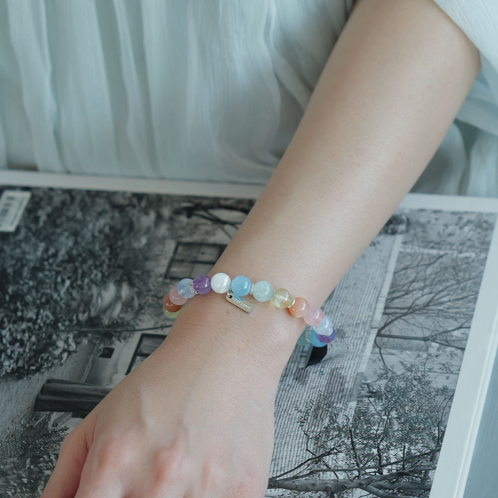The Monet pastel multi-gemstone bracelet by Soul Lykke. A serene watercolor-inspired gradient featuring 8mm AAA-grade Hibiscus Rose Quartz, Teal Lepidolite, Aquamarine, and Lavender Amethyst on a seamless background. This is a healing crystal bracelet by Soul Lykke.